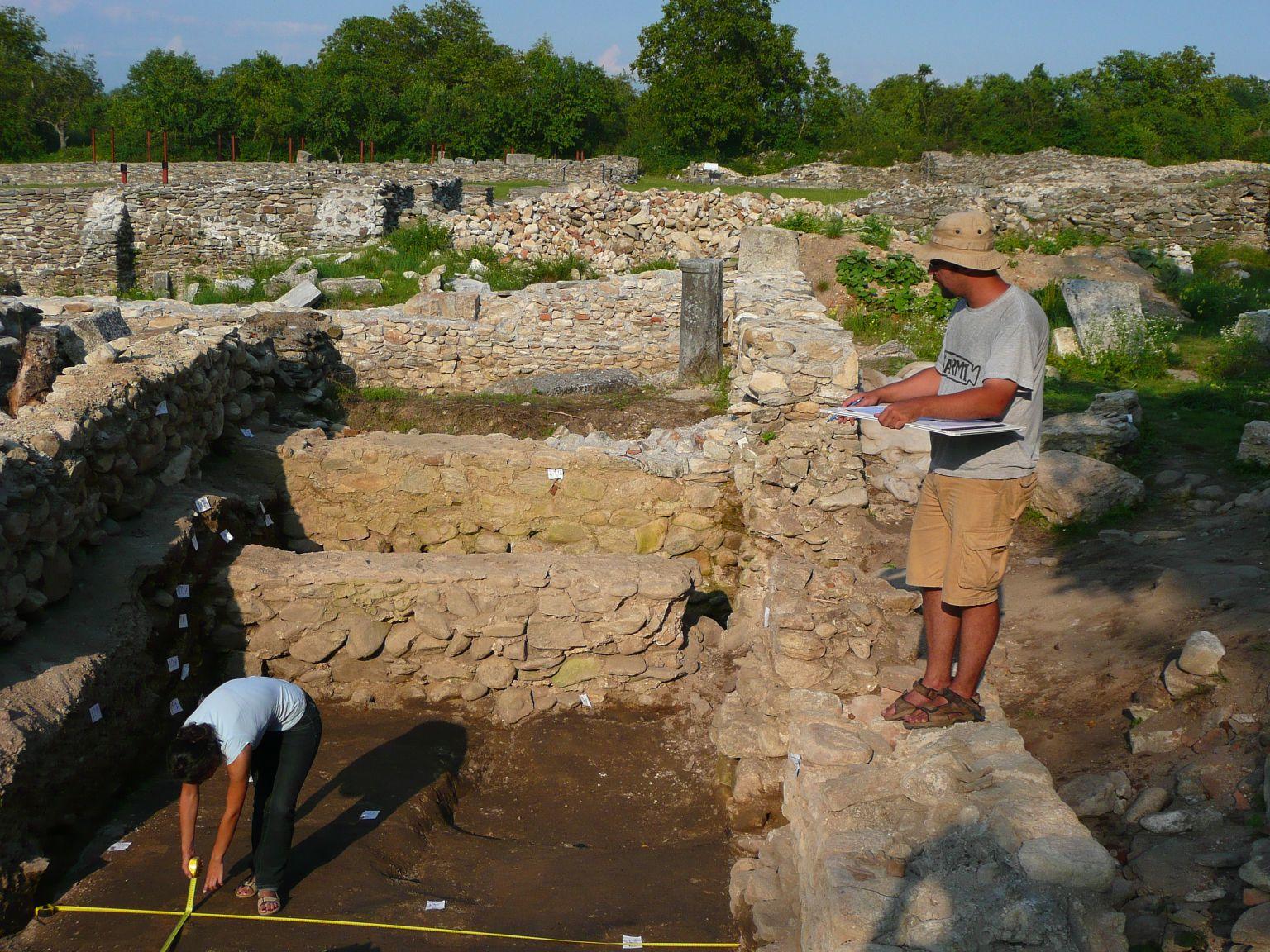 A Projects Abroad volunteer measures out the dig site during her volunteer archaeology work in Romania. A Projects Abroad volunteer is pictured measuring out the dig site during her volunteer archaeology work in Romania.
